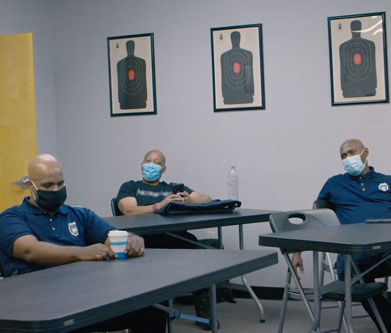 Police officers in a conference room